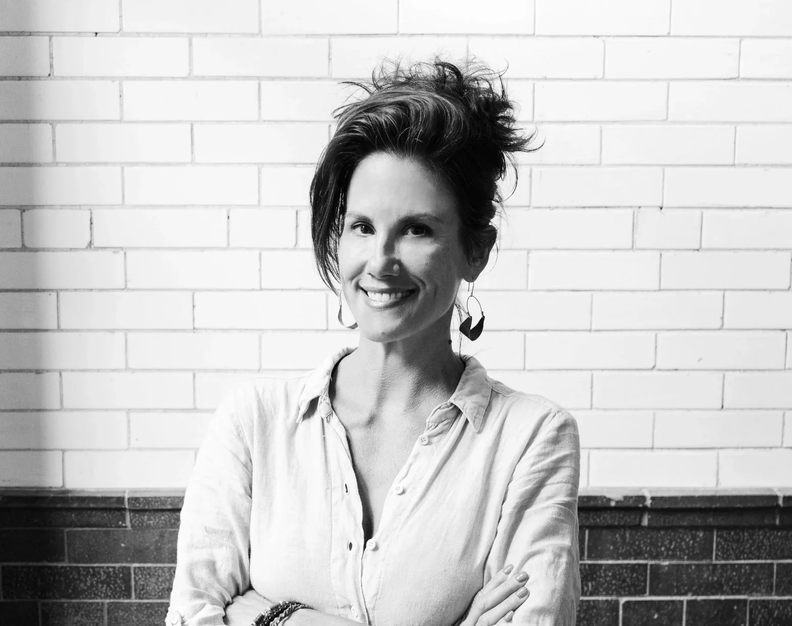 Nicole Alexander, Founder and Principal Designer at Siren Betty Design, professional headshot.