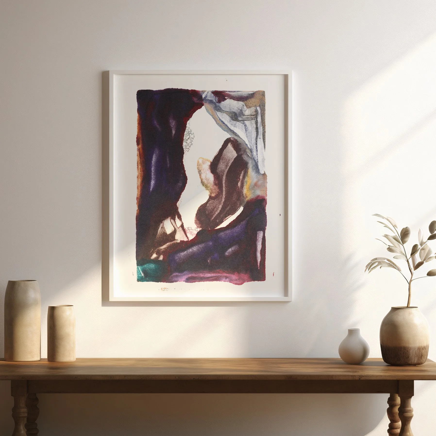 Threshold by Melissa McGill displayed in a white frame above a wood table in a sunlit neutral interior, with deep violet forms surrounding an open central passage.