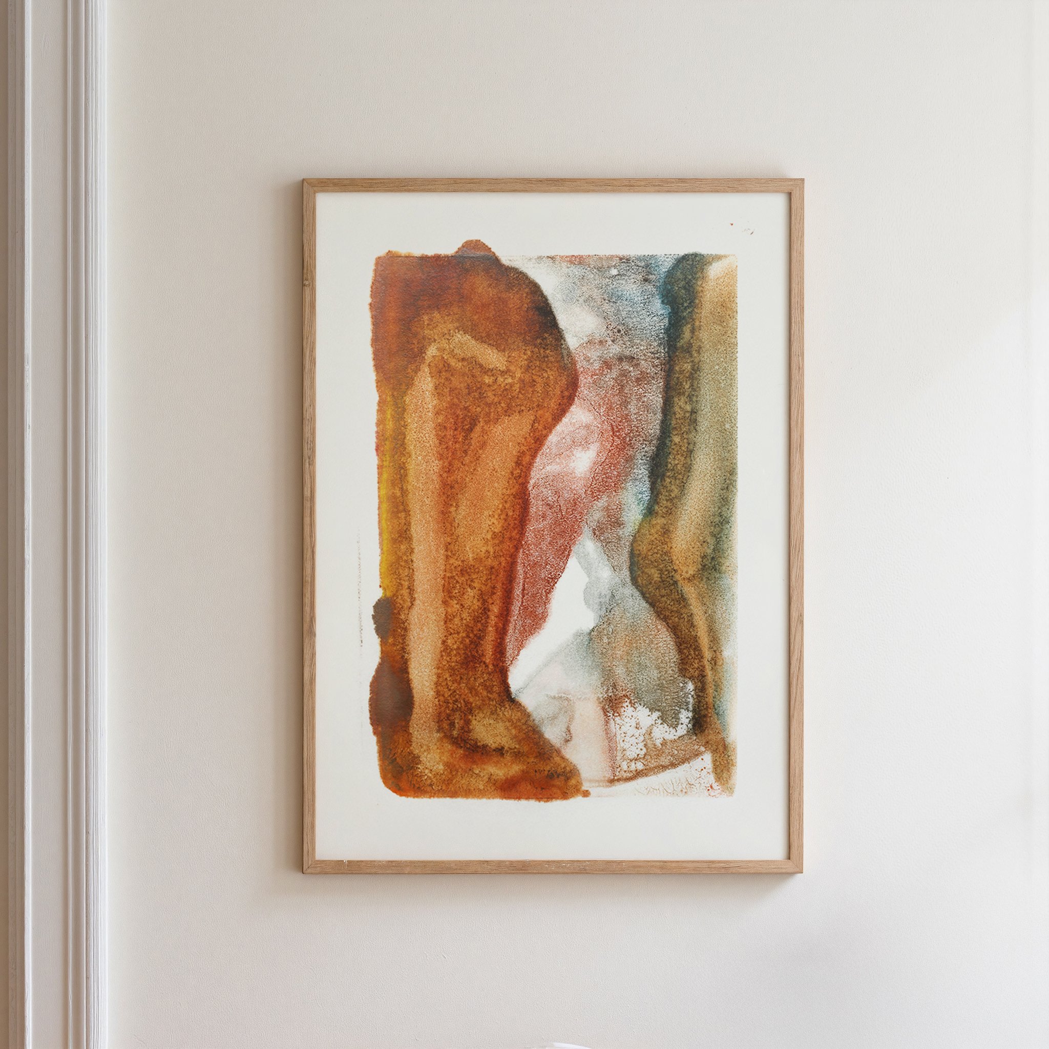 Arroyo by Melissa McGill displayed in a natural wood frame on a white wall, with a tall rust-orange mass and narrower olive-brown form enclosing a pale, winding passage.