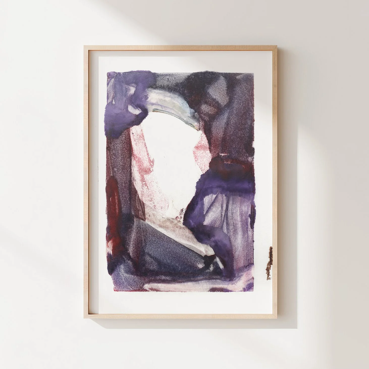 Dormancy by Melissa McGill, abstract encaustic monotype on abaca paper with deep violet, plum, and burgundy forms surrounding a pale central opening, displayed in a natural wood frame.