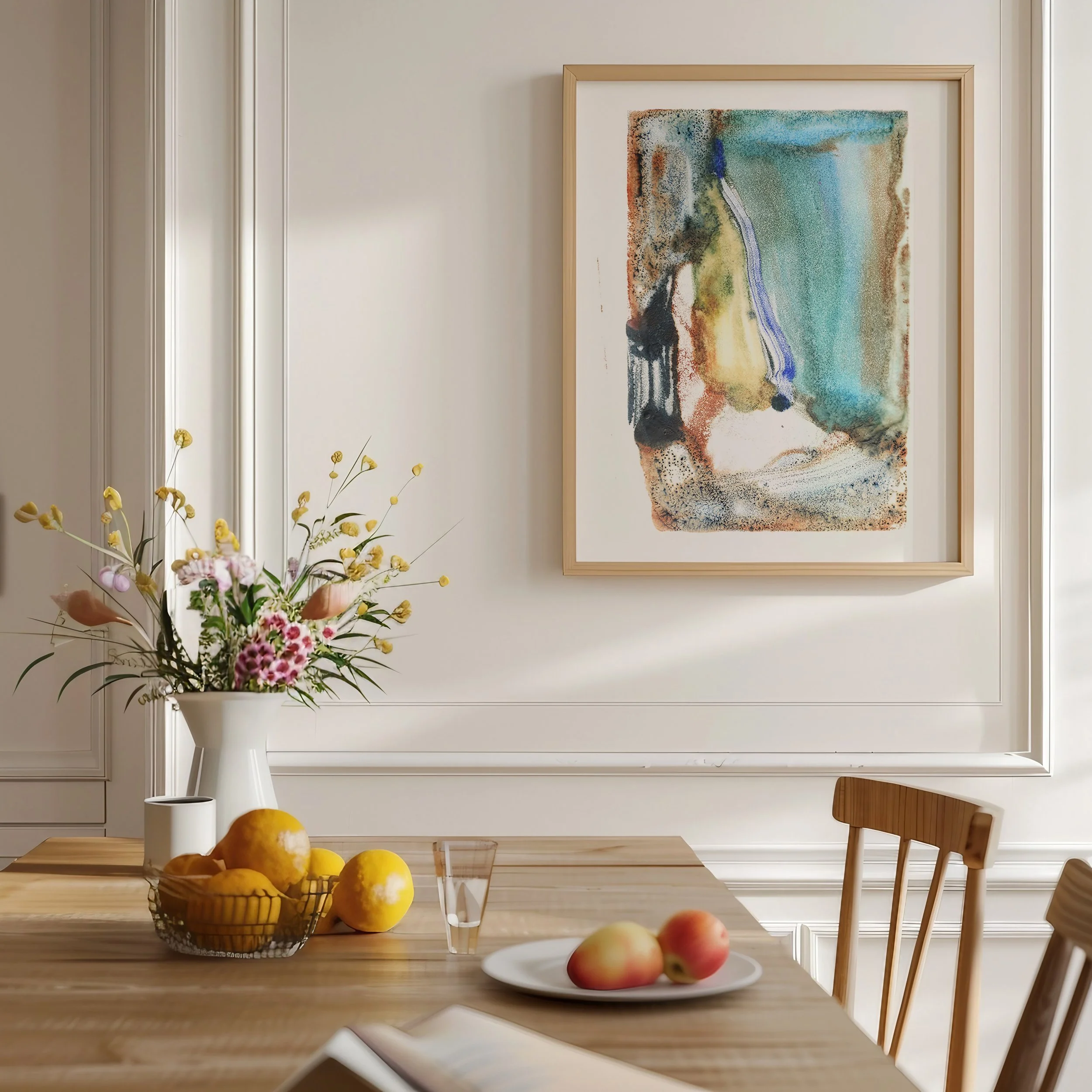 Sediment by Melissa McGill displayed in a natural wood frame above a dining table, with turquoise and mineral-blue fields beside ochre, rust, and charcoal forms.