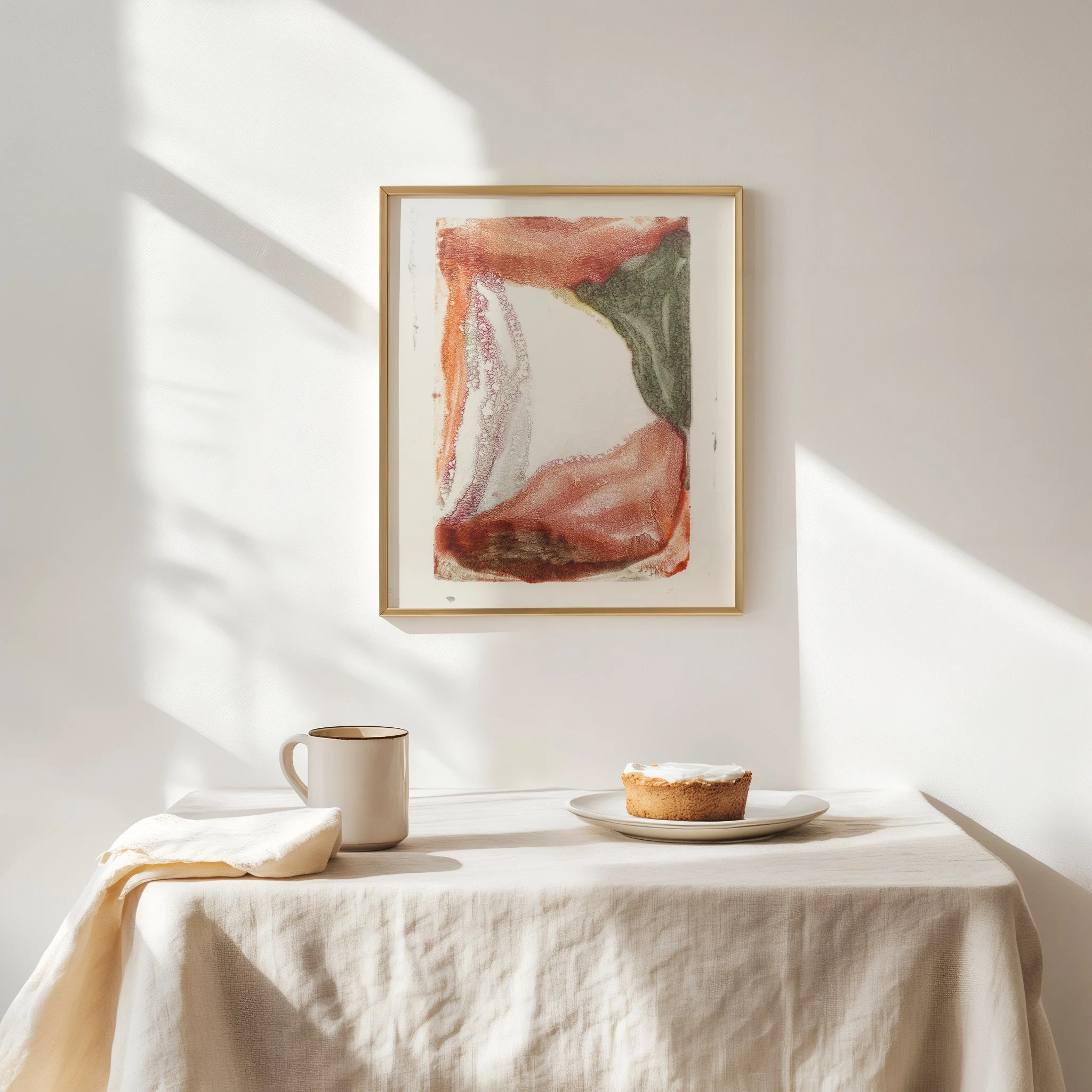 Weathering by Melissa McGill displayed in a natural wood frame above a linen-covered table in a softly lit neutral interior.