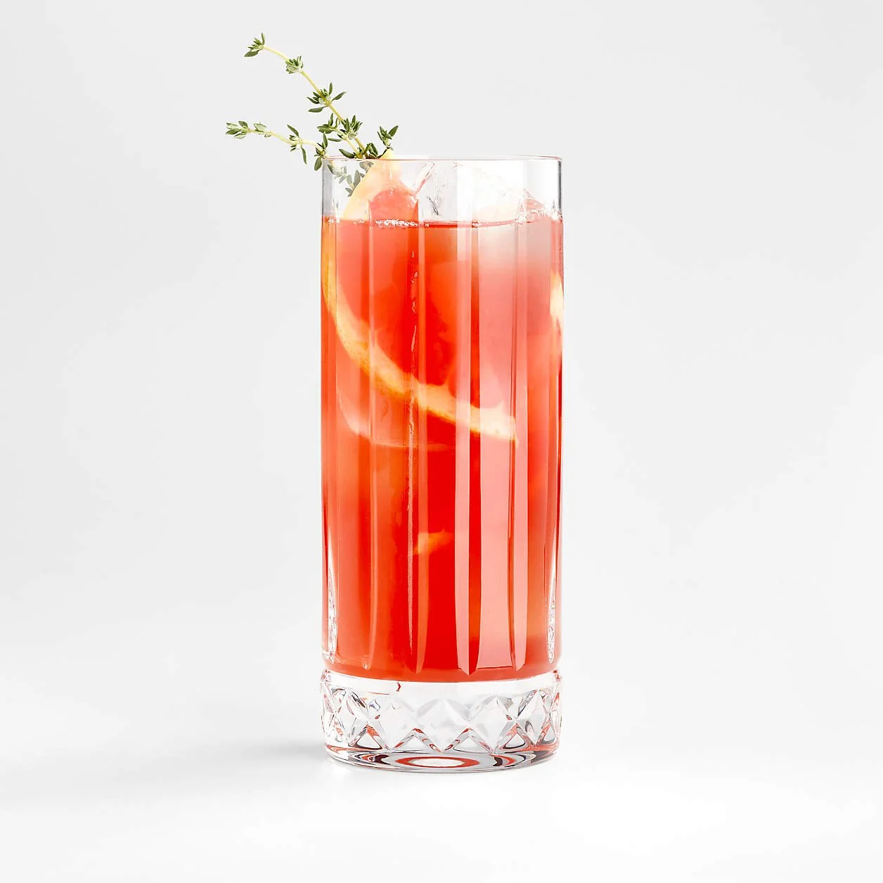 high ball glass with pink grapefruit soda and fresh garnish