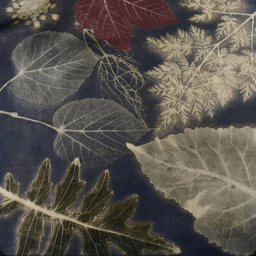 ecoprint with plant-based background color and clear botanical impressions