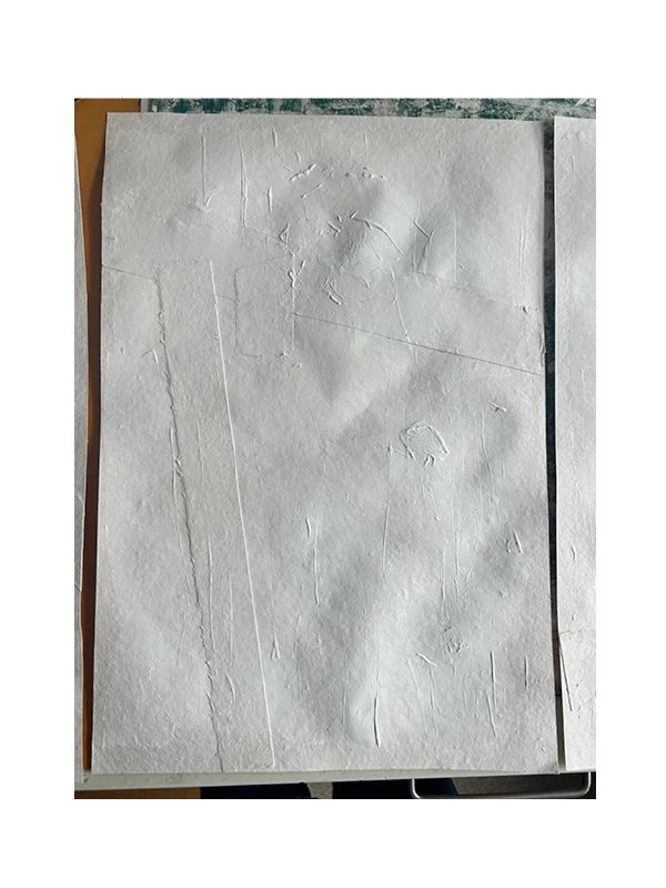 Once dry and flat, Gesso is layered over the sheet. It pro-tects, stabilises, and introduces texture. Application can be with brushes or any object that leaves or not a mark.