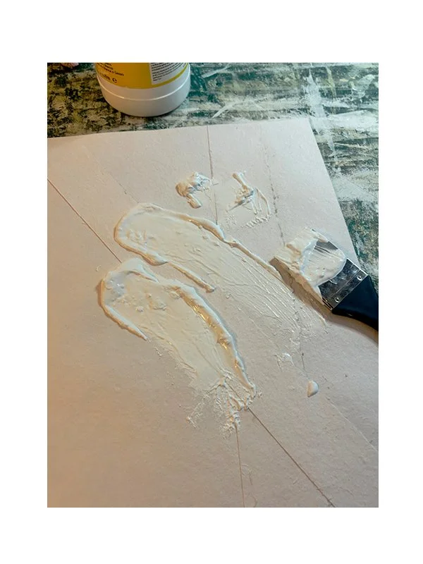 Once dry and flat, Gesso is layered over the sheet. It pro-tects, stabilises, and introduces texture. Application can be with brushes or any object that leaves or not a mark.