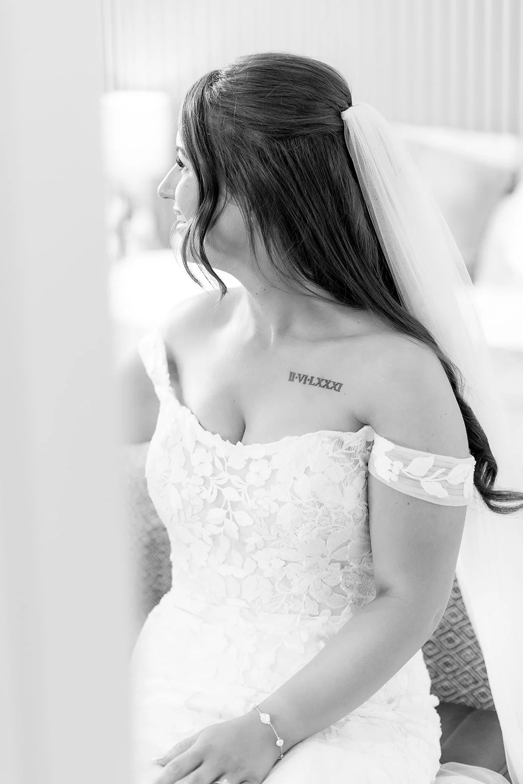Bride on the bed on her wedding morning for a luxury wedding in Scotland.