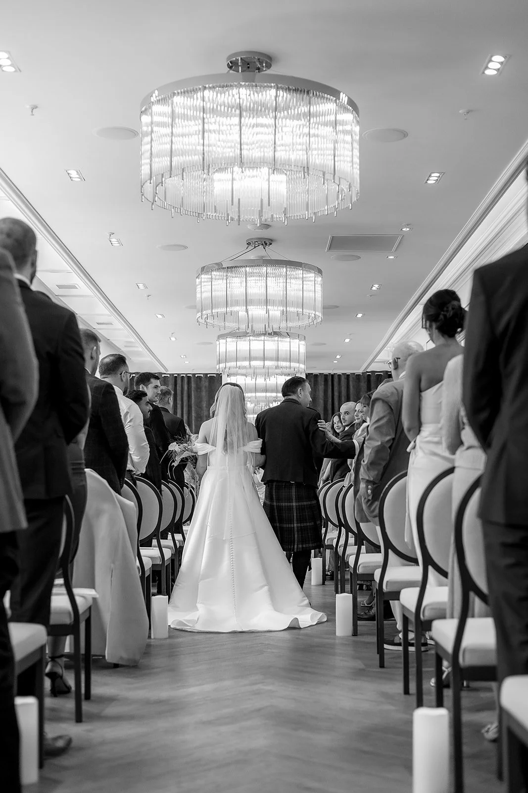 Bride and her father walking down the aisle at The Exchange, a luxury wedding in Scotland.