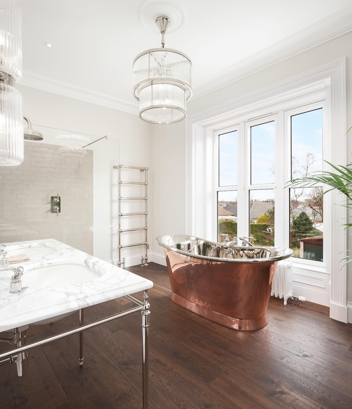 &bull; Copper Elegance&hellip; 

This stunning space flooded with natural light is completed with Drummonds&rsquo; fittings, from freestanding bath to vanity suite lighting. The Tyne Copper Bath Tub is simply breathtaking, as is the view seen from th