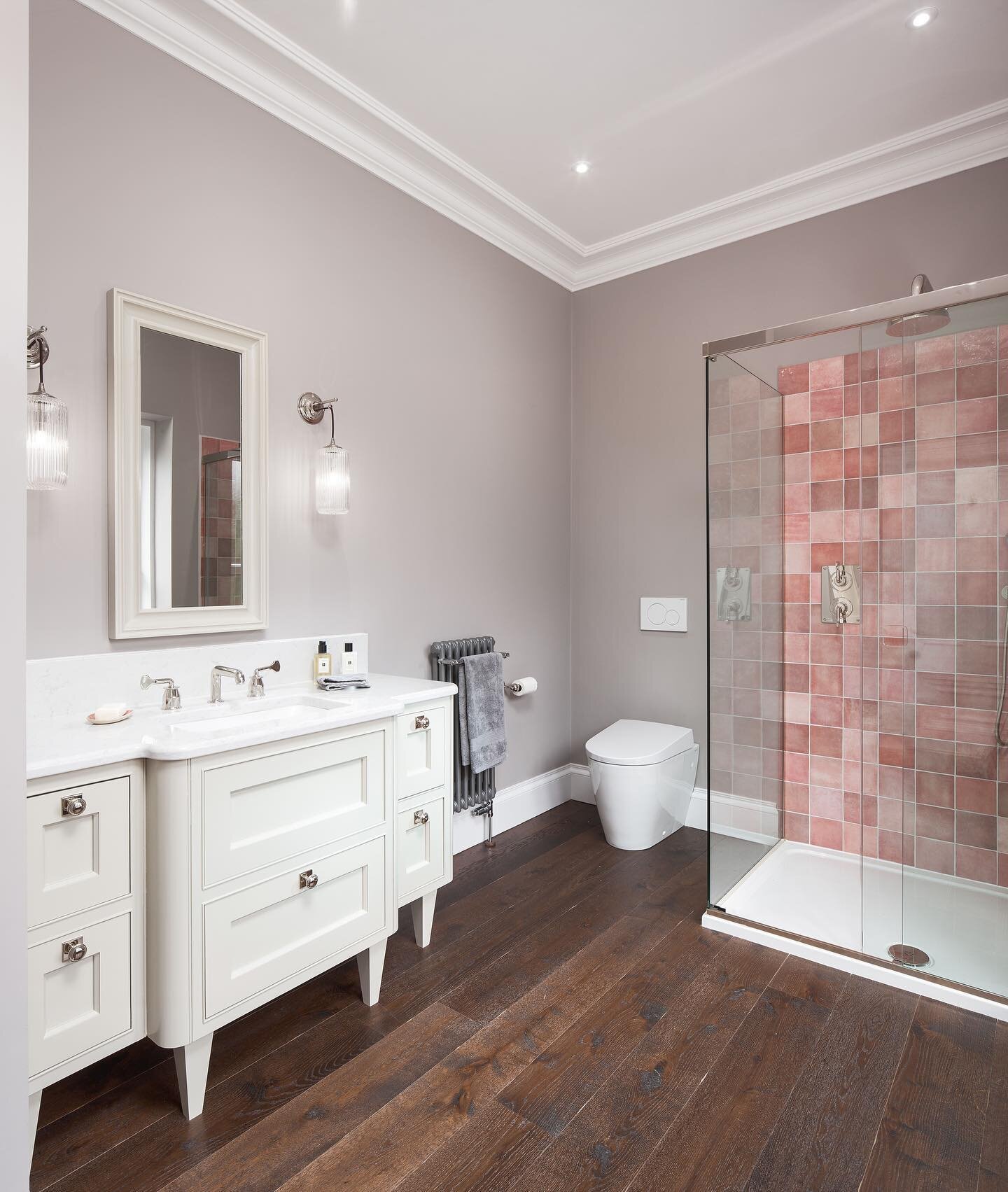 This Aberdeenshire shower room is beautifully unique, from the pale rose shower tiles, to the bespoke vanity unit and custom-selected marble top. Mixing carefully crafted cabinetry with handmade brassware from @drummonds_bathrooms ensures this shower