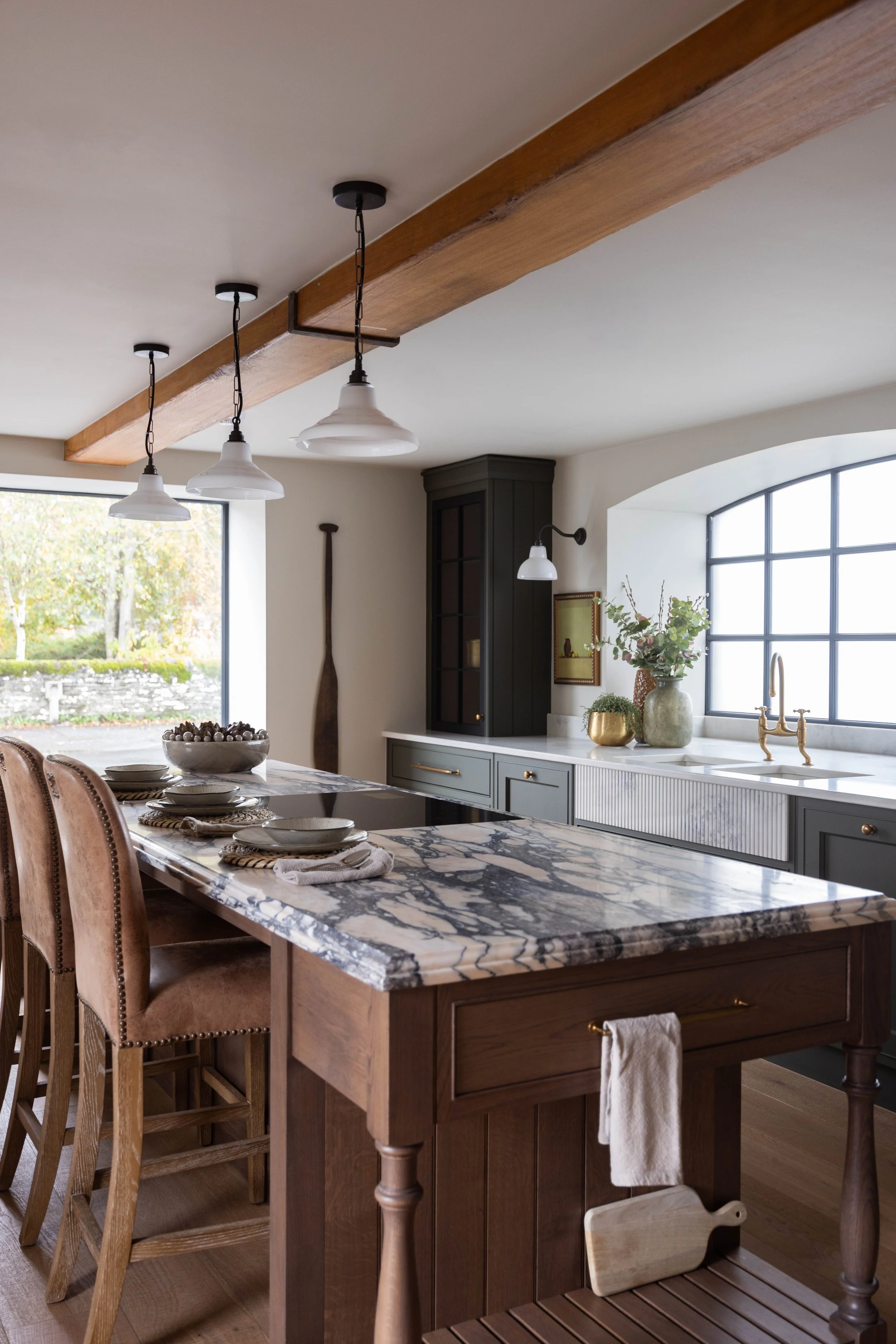 Dark oak kitchen with viola marble island