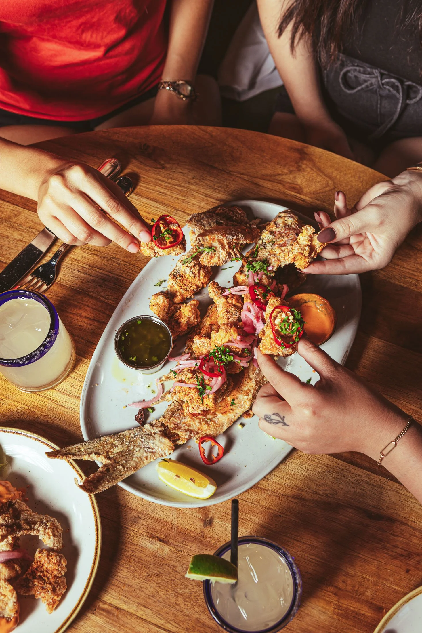 Food photography of fried fish dish with crispy texture and restaurant plating