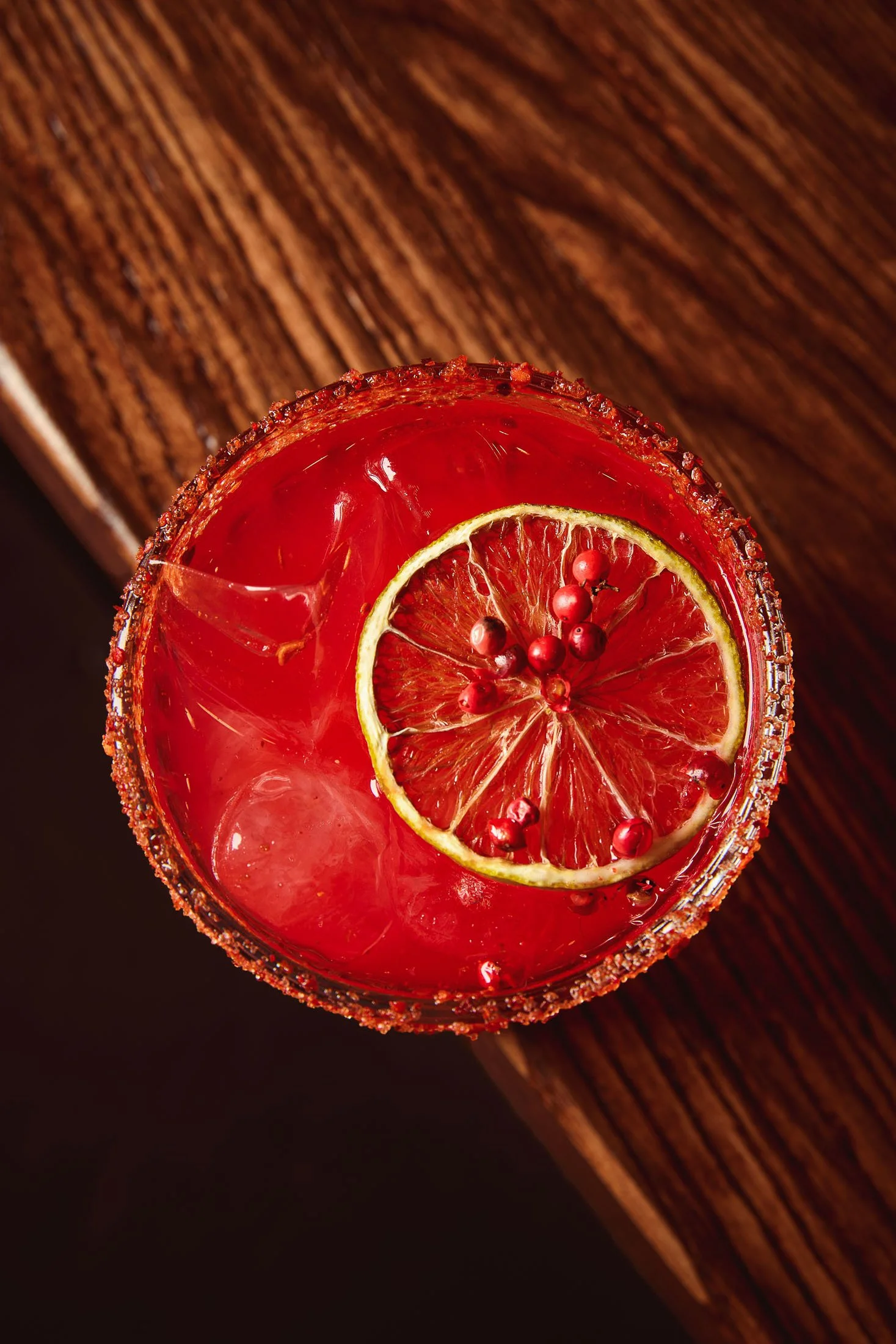 Cocktail photography featuring a red-colored drink in a restaurant setting in Miami with editorial styling.