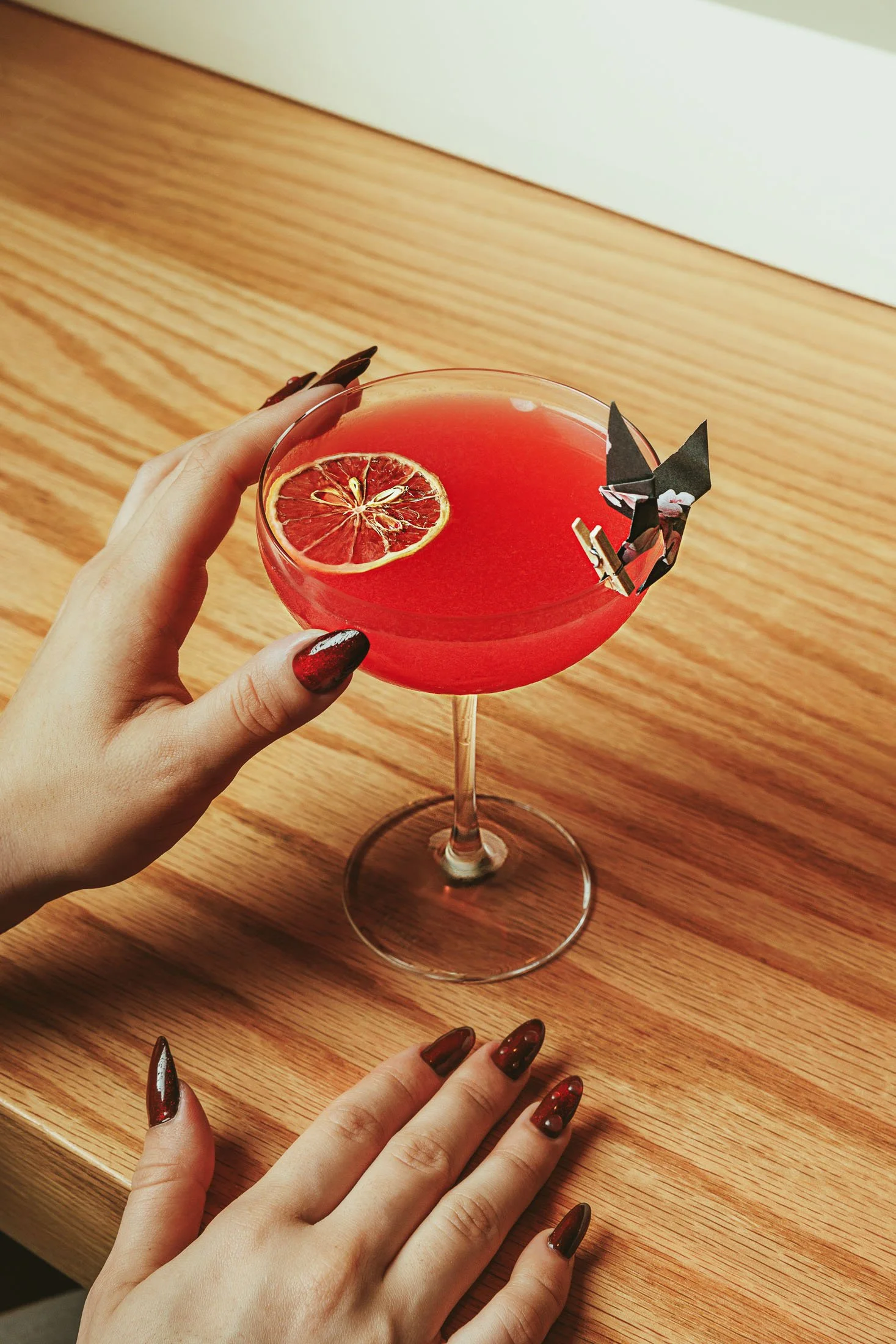 Halloween-themed cocktail photography with moody lighting and a seasonal bar aesthetic in Miami.