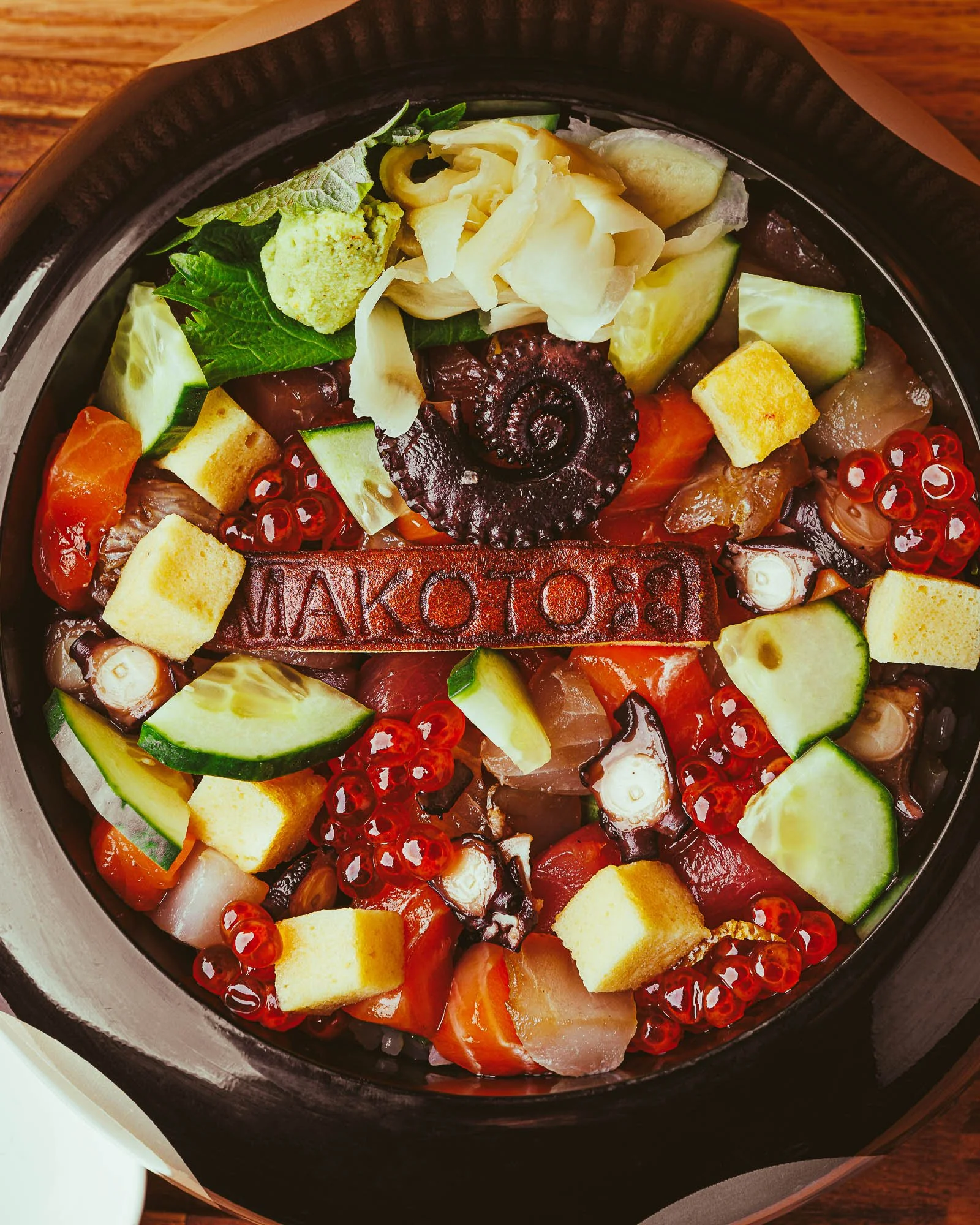 Signature seafood photography at Makoto Miami featuring octopus and caviar in an elegant fine dining dish