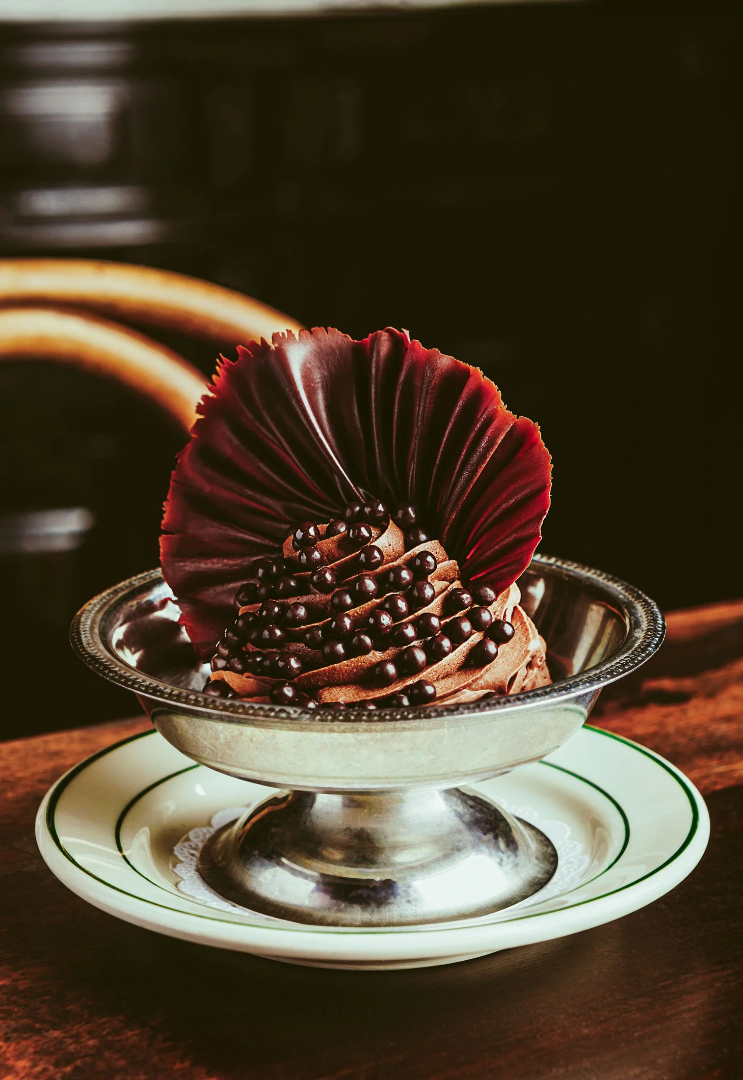 Fine dining chocolate dessert photography at Pastis Miami featuring elegant French-style plating