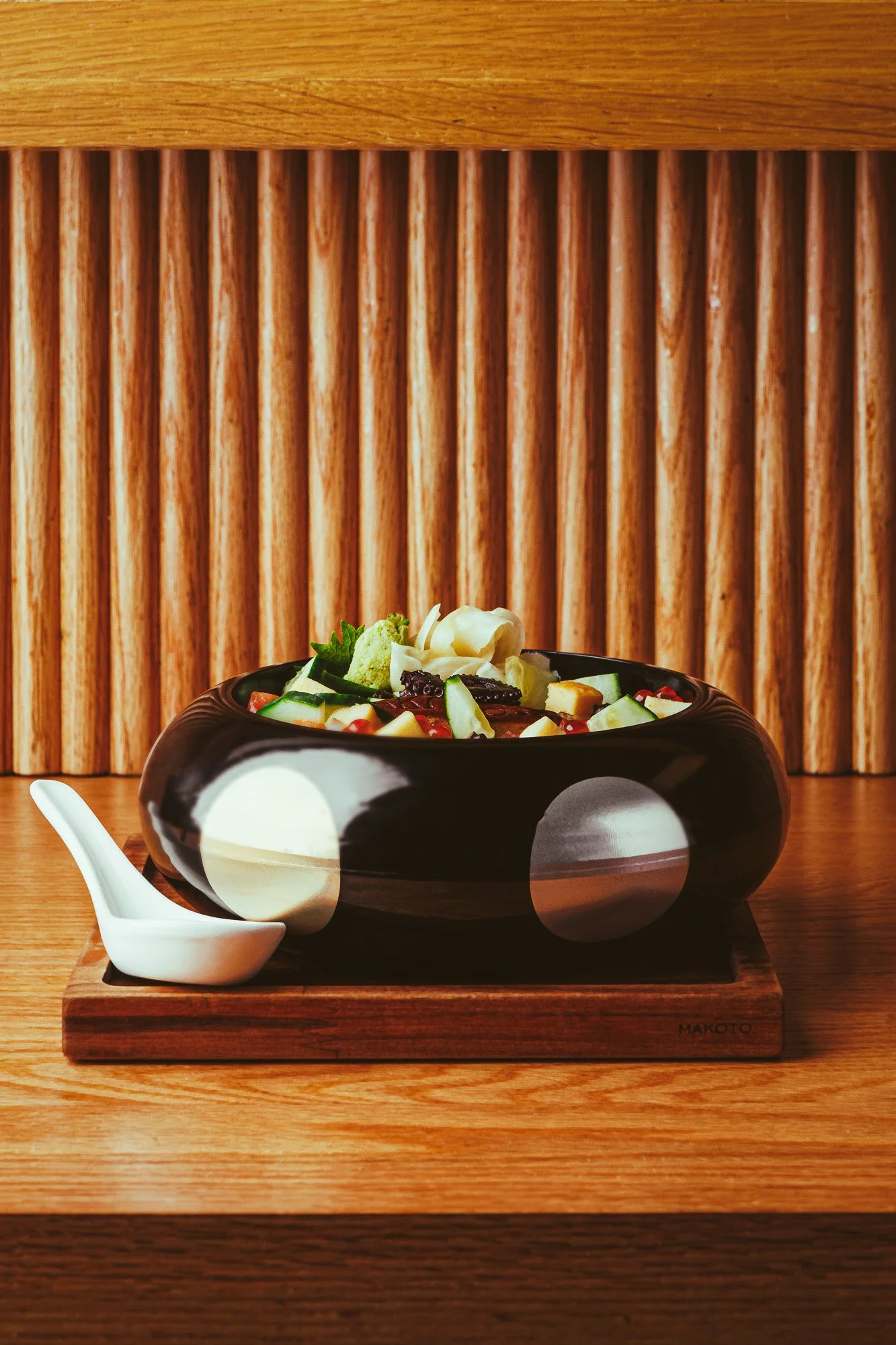 Signature seafood photography at Makoto Miami featuring octopus and caviar in an elegant fine dining dish