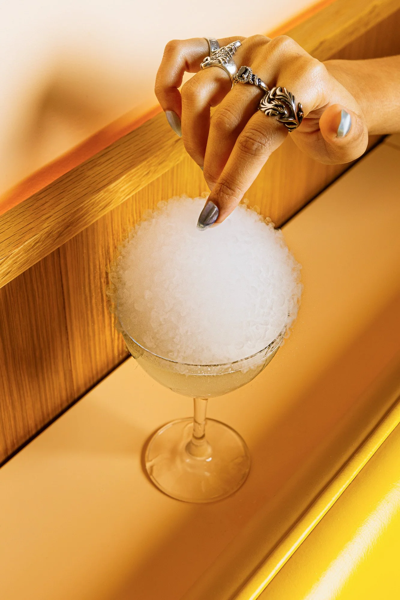 Cocktail photography featuring a red-colored drink in a restaurant setting in Miami with editorial styling.