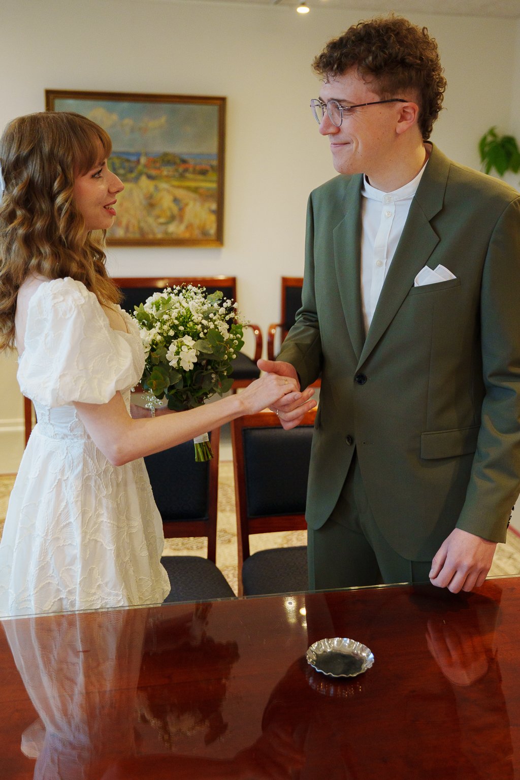 Wedding couple during their civil ceremony at Aeroe City Hall.