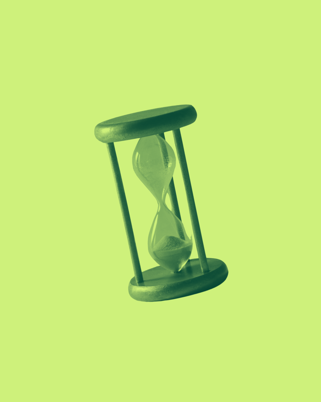 Green-colored hourglass with sand inside, standing upright on a light green background.