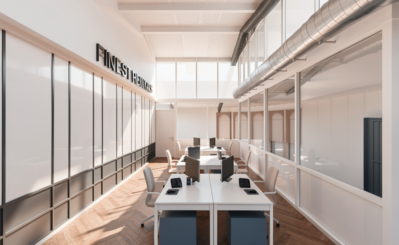 An industrial office workspace with four white desks, each equipped with monitors, a keyboard, a mouse, and an office chair. The room has large windows, wood flooring, and a wall sign that reads 'FINEST RENTALS' . Exposed duct on the ceiling.