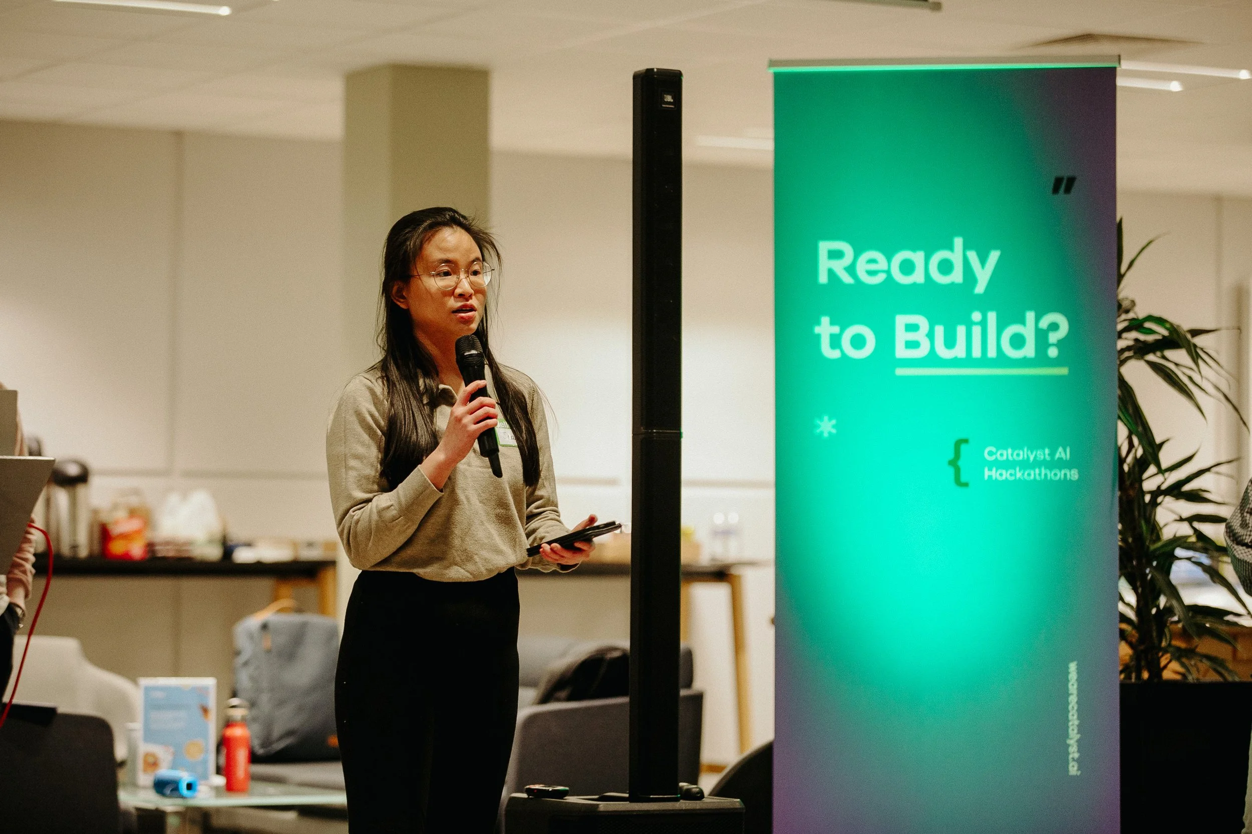 People presenting at a Catalyst AI Hackathon