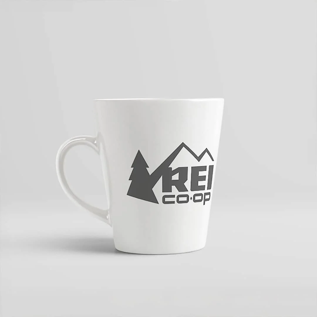REI Co-op branded ceramic coffee mug commercial product photography white background