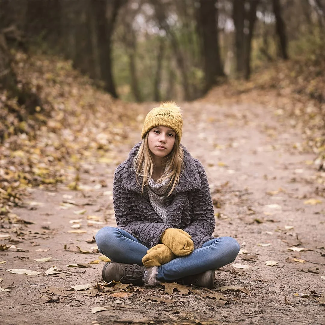 young girl outdoor lifestyle portrait on autumn forest path natural light