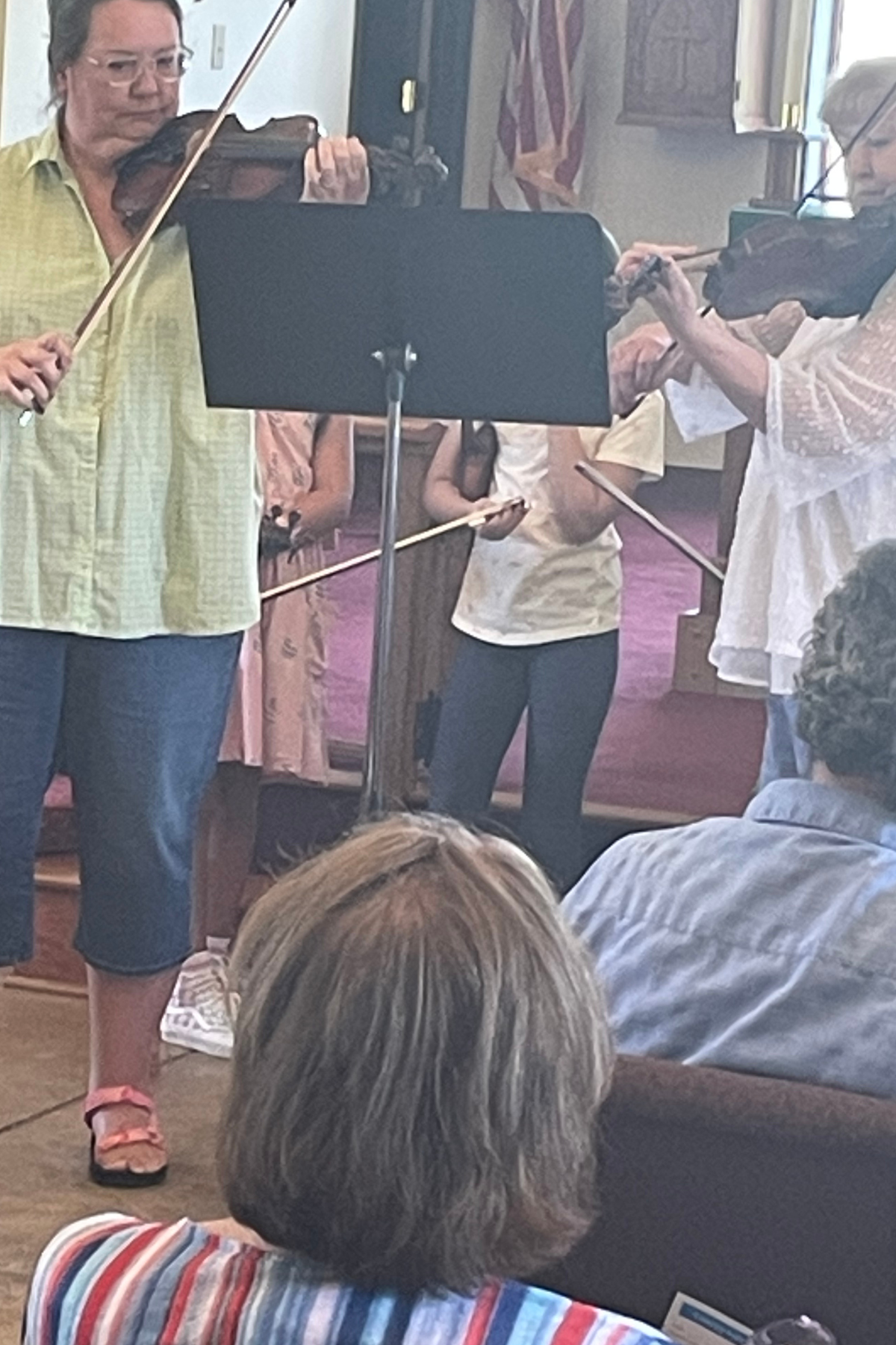Elaine performing with a student