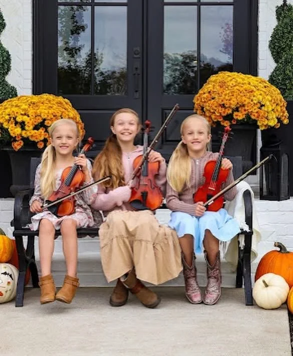 Three of Elaine's violin students
