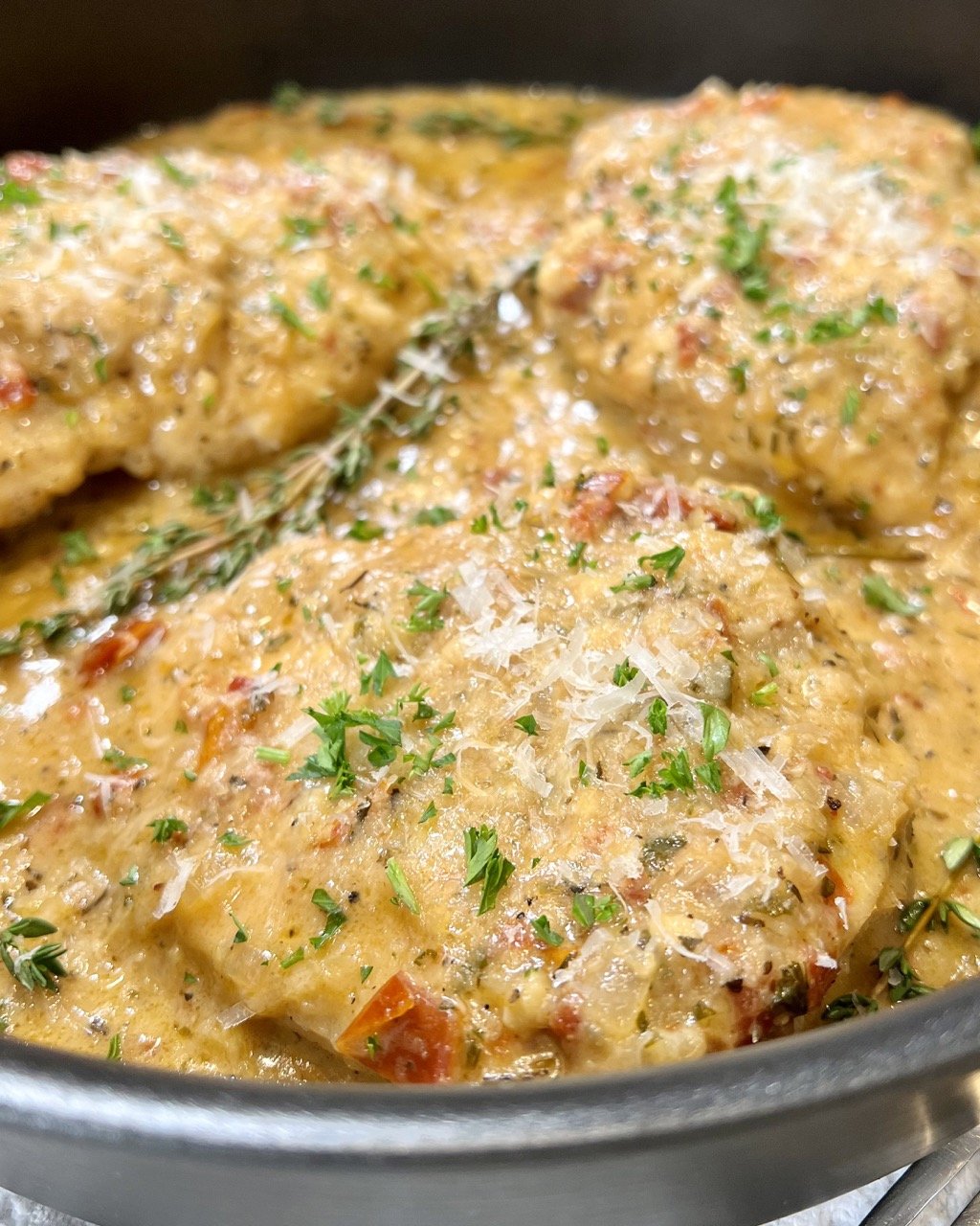 Marry Me Chicken arranged in a pan