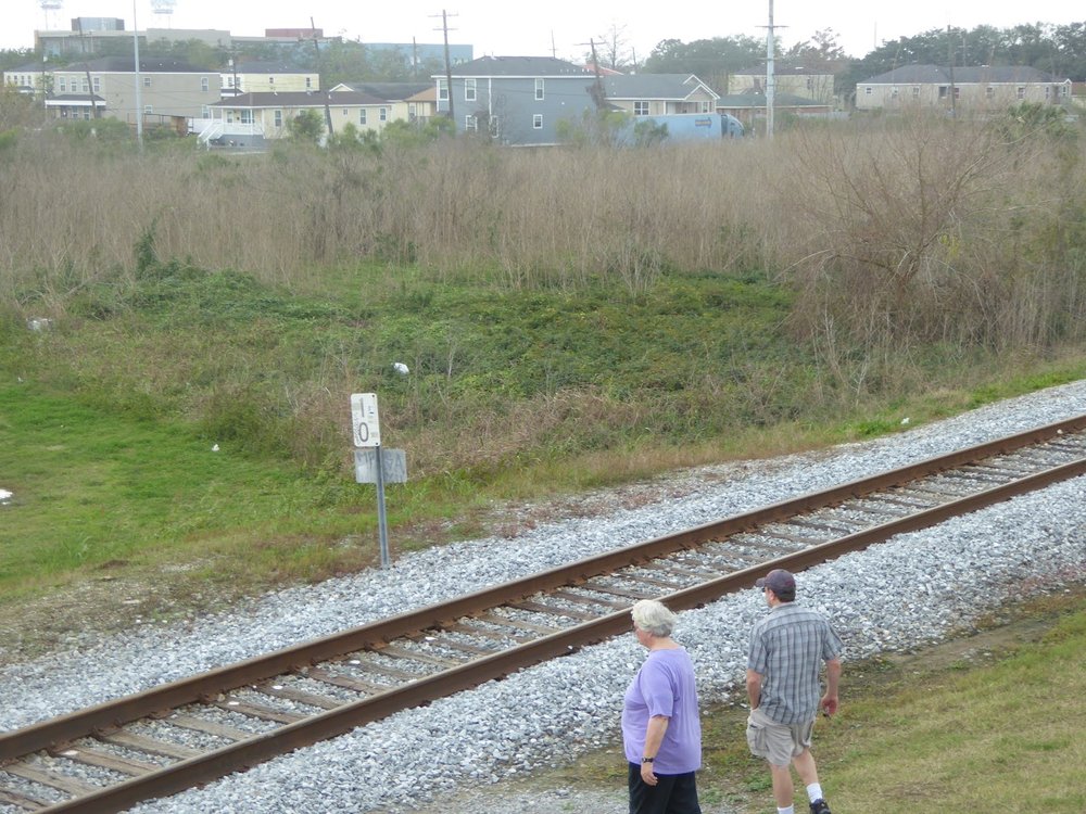  Site of the levee break, with rebuilt homes background (Julianne and Tim - I'm on the levee)  