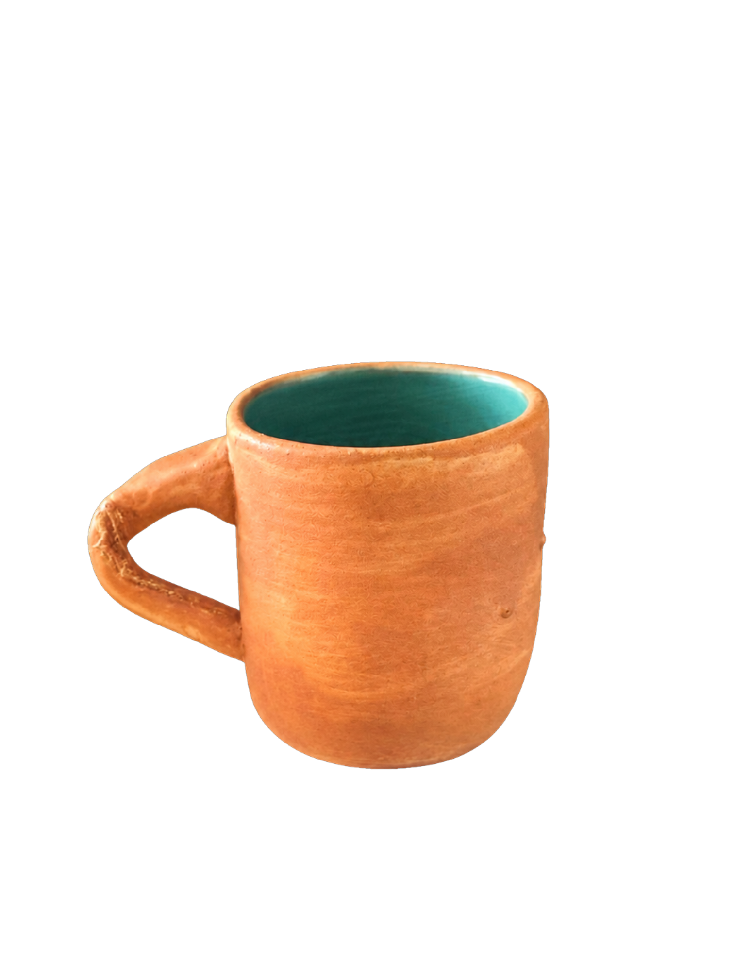 Handcrafted terracotta-orange ceramic mug with a teal glazed interior
