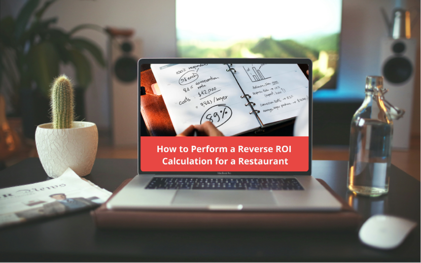 Laptop on desk open to a video about calculating ROI