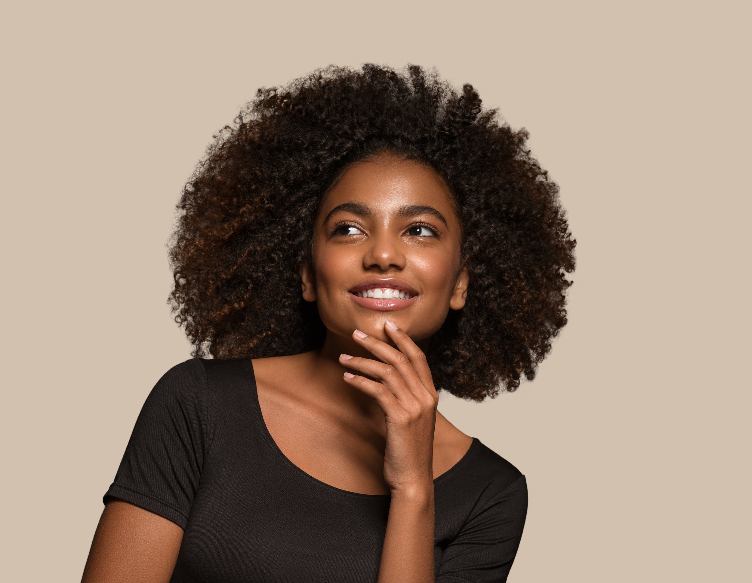 beautiful-african-woman-black-t-shirt-portrait-afro-haircut-touching-her-face-color-background-brown.jpg
