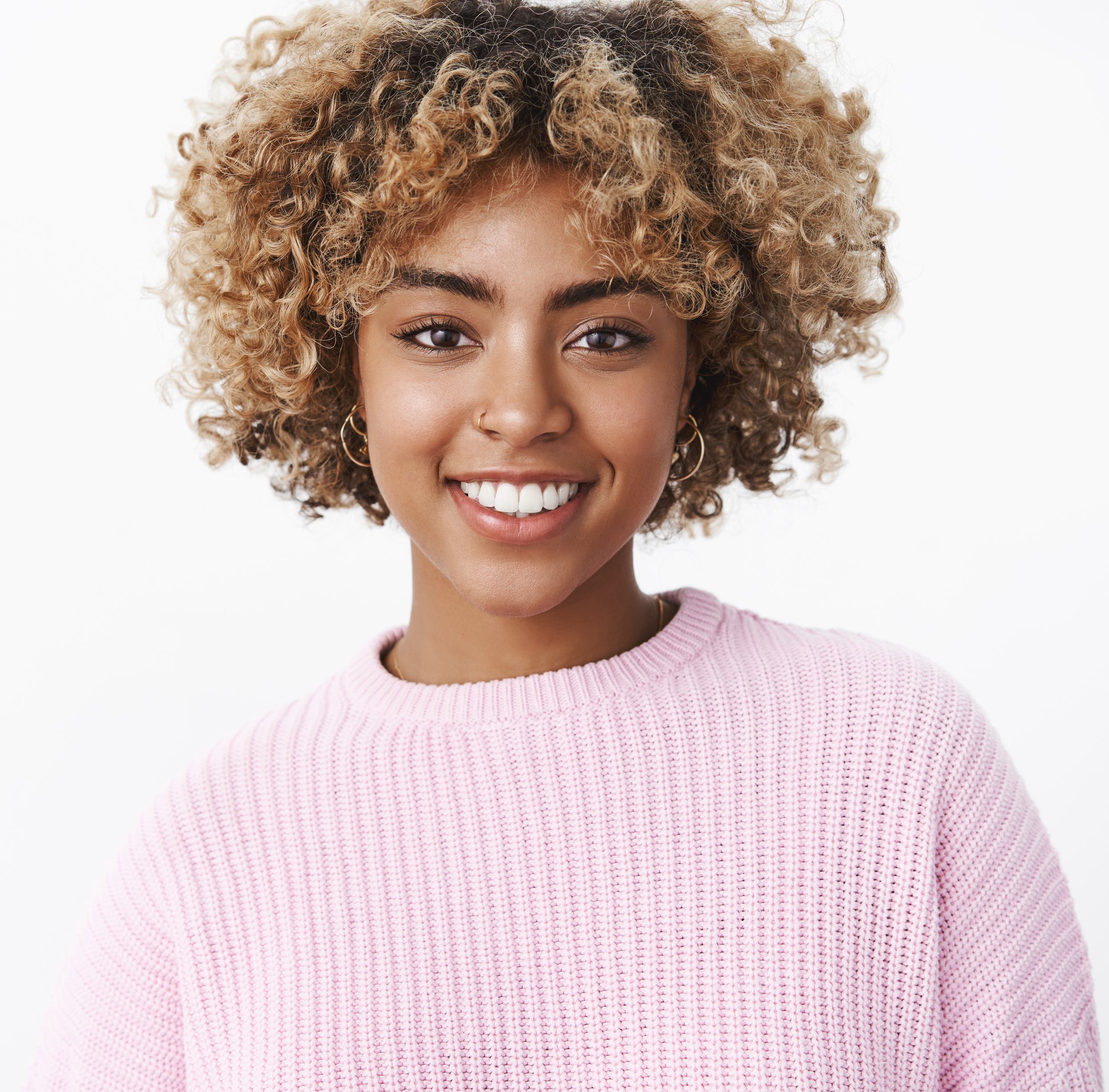 close-up-shot-charismatic-friendly-looking-happy-nice-dark-skinned-girl-with-pierced-nose-perfect-smile-standing-delighted-cute-white-wall-sweater-enjoying-family-holiday-dinner CROPPED.jpg