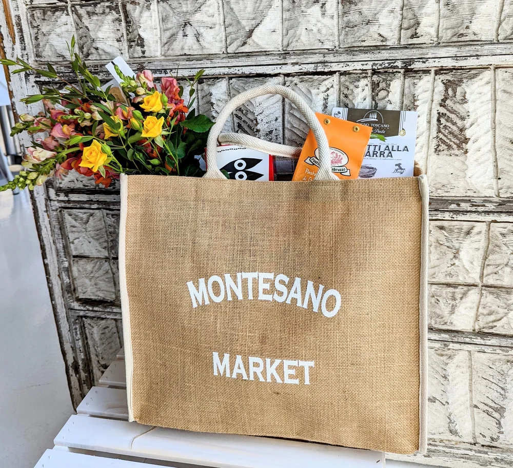 Montesano Market branded jute shopping bag on Coast Village Road