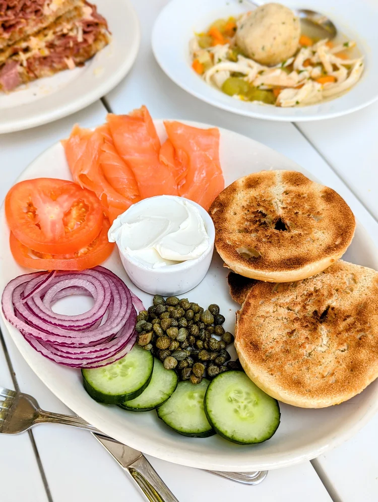 Curated wine and olive oil display at Montesano Market