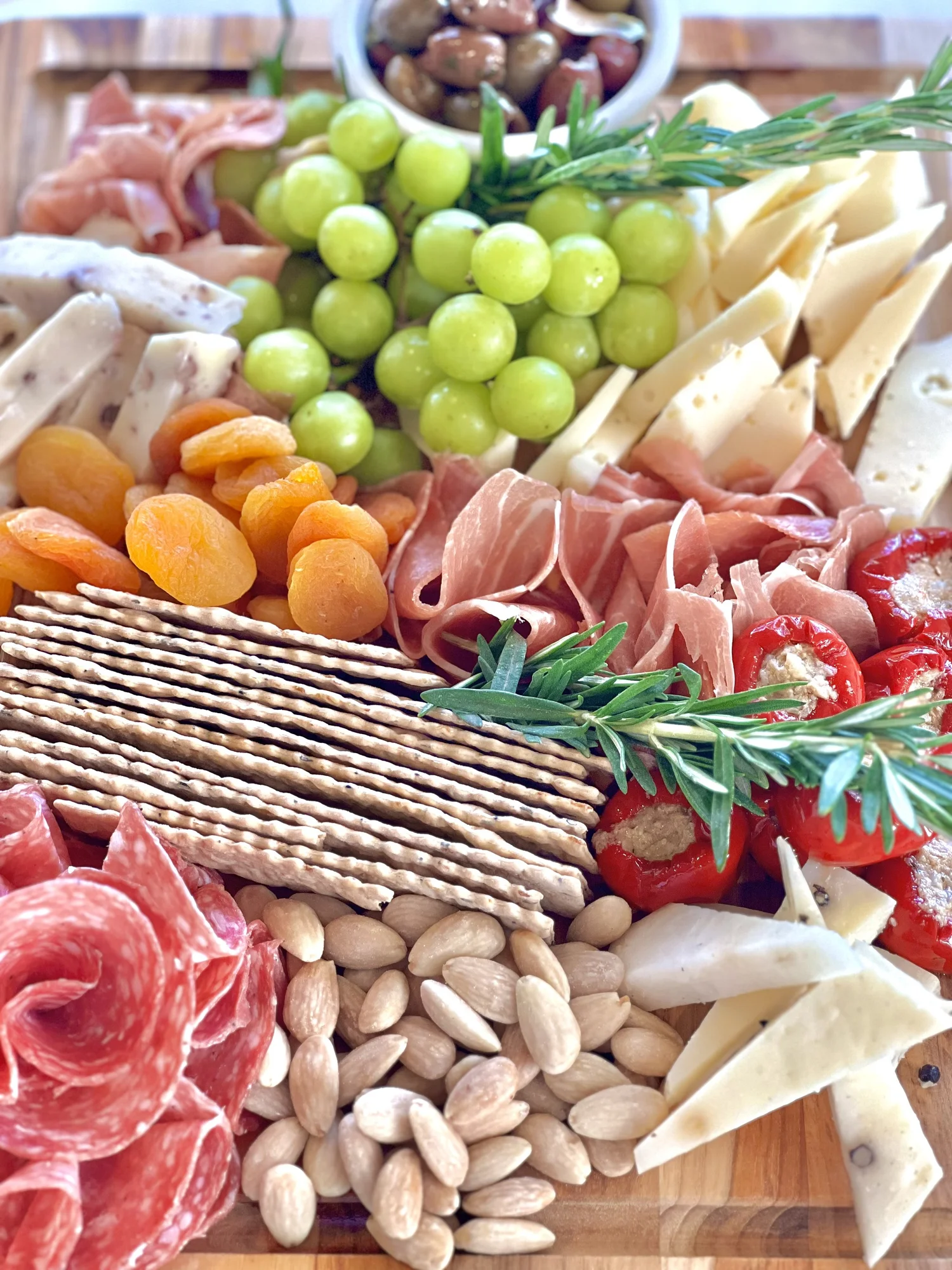 Large charcuterie board with imported Italian meats and artisan cheeses at Montesano Market