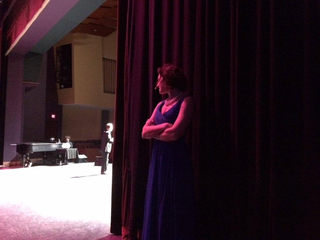 Annie Figenshu standing in the wings backstage during a performance of Broadway’s Next Hit Musical in 2016.