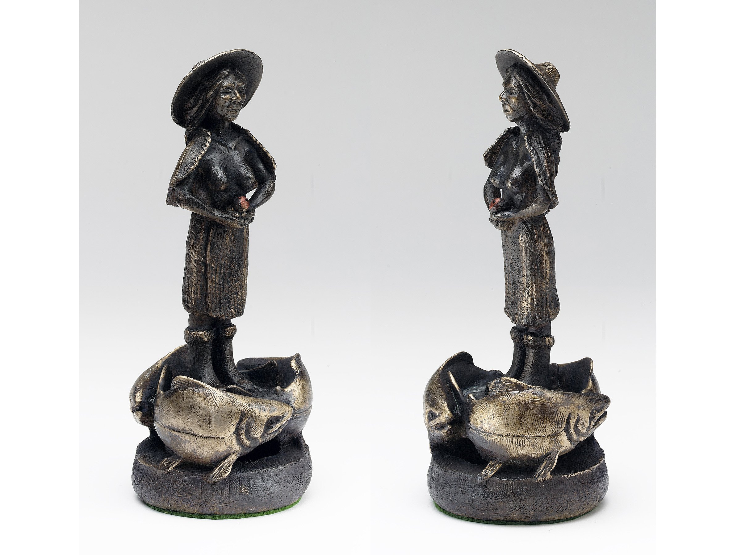 3. SALMON GIRL , Tom Jay 1990. Cast Bronze. Salmon Girl holds the mythic eyed-salmon egg, dreaming the salmon home. 10”X4”X4” One of three.
