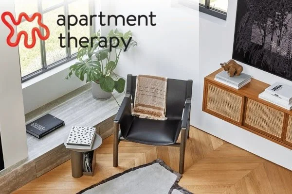 Apartment Therapy with chair and side table as backdrop