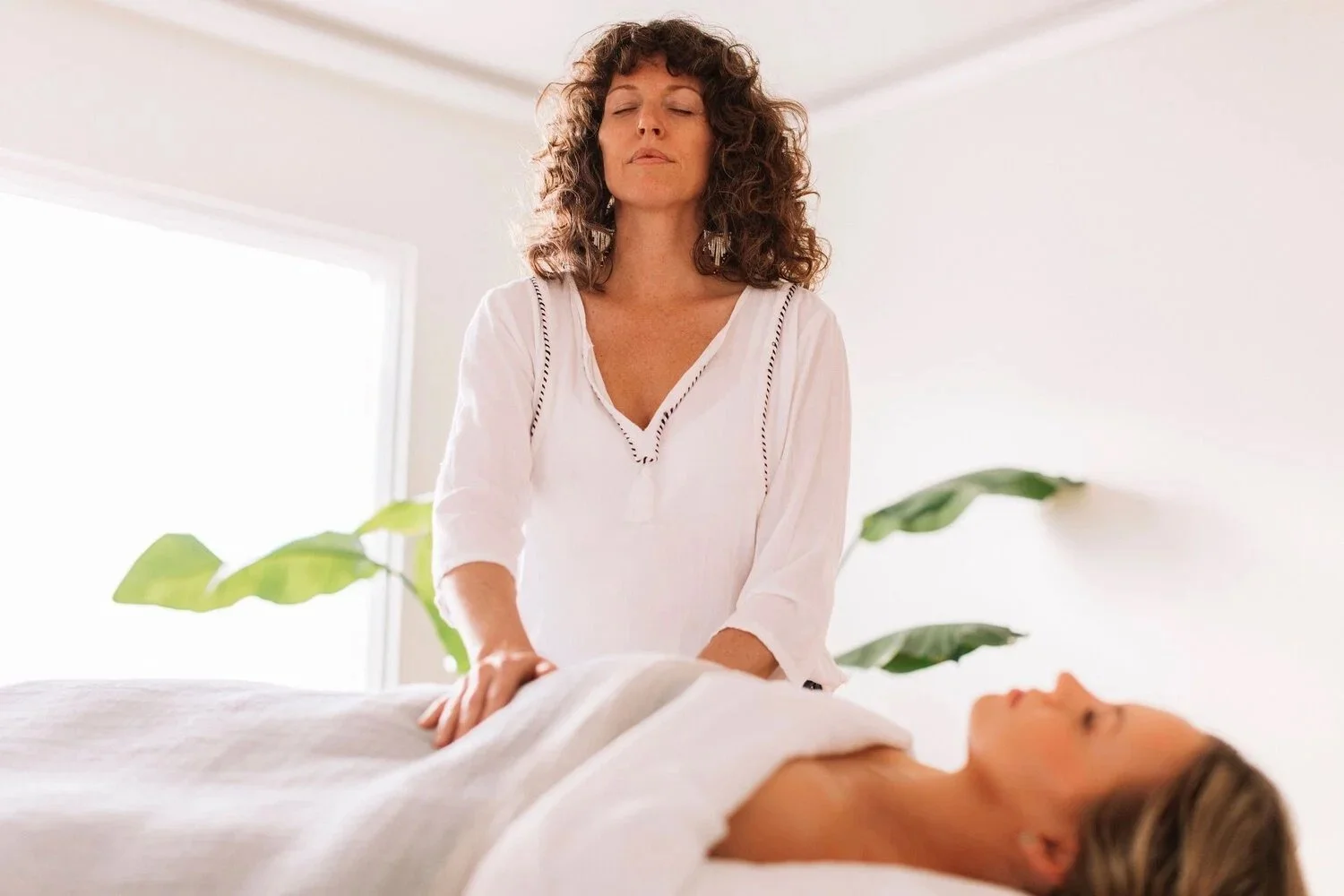 Woman performing reiki healing