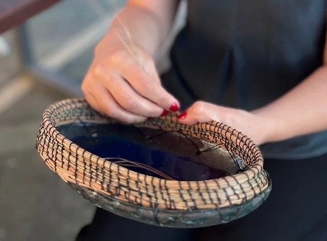 Detail of hand-foraged pine needles stitched onto a glazed ceramic rim