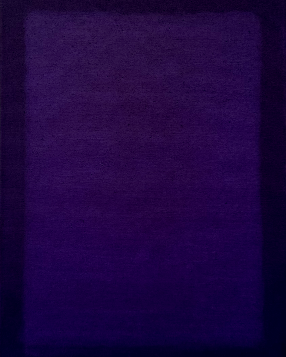 Close-up of a purple fabric or surface with a smooth texture.