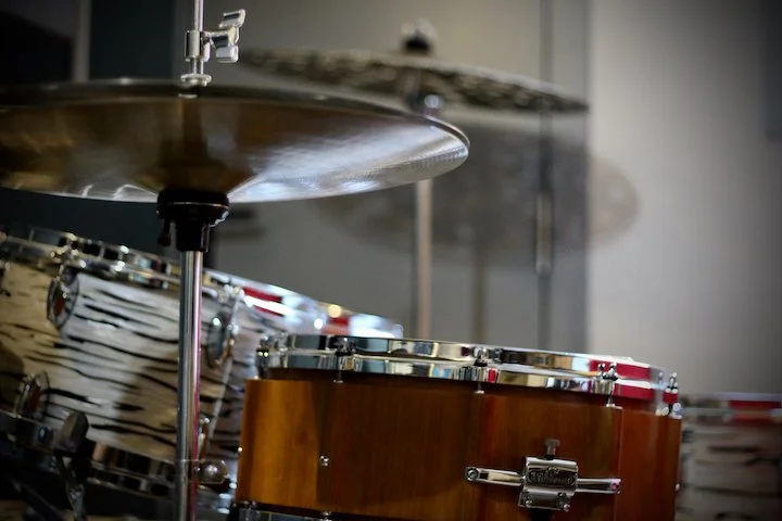  •  Soundproofed and Acoustically Treated , the studio creates a distraction-free space with excellent sound quality.  •  Two High-Quality Acoustic Drum Kits  are provided for a hands-on learning experience.  • A  Professional PA System  is installed