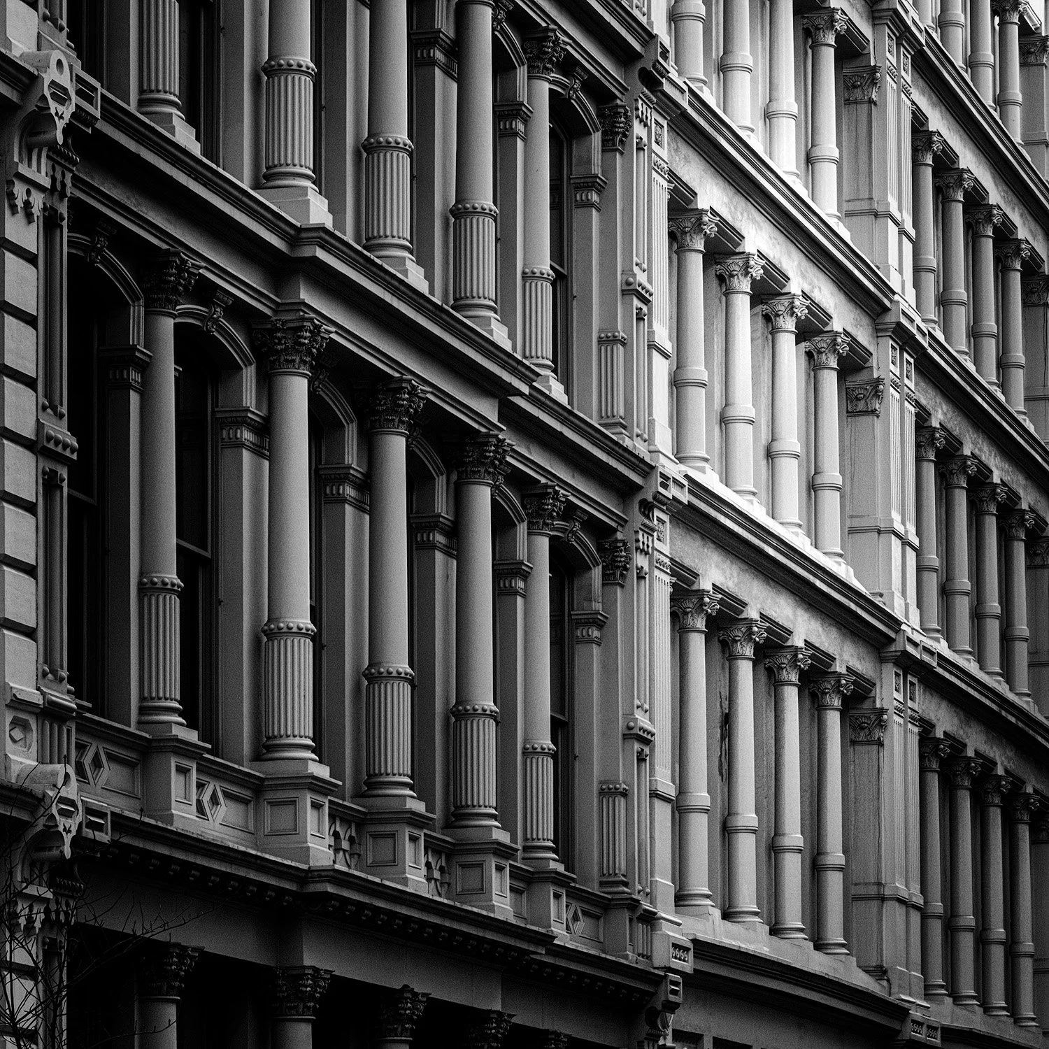 Image of a block of building with columnar fronts — NYC