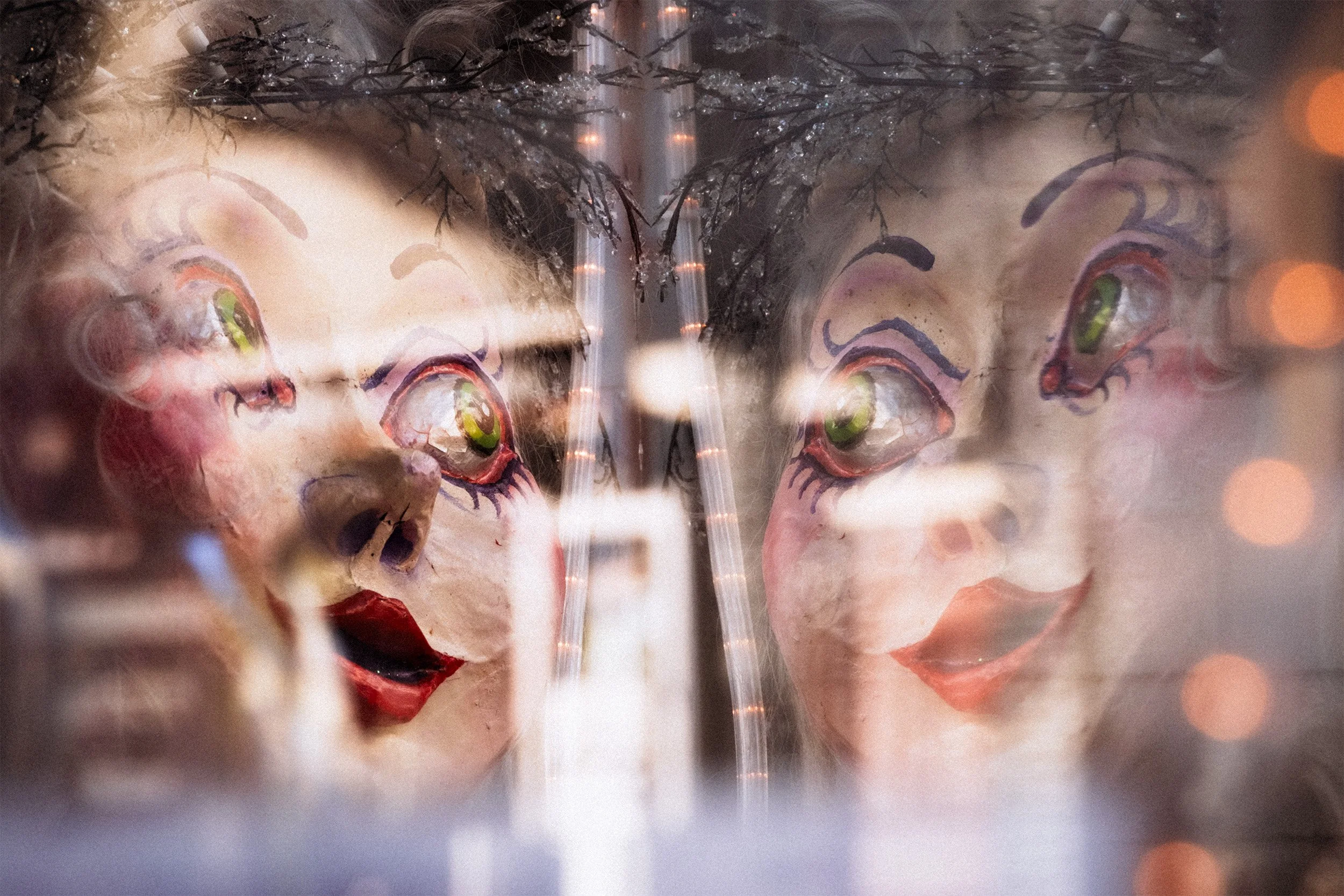 Image of a mask with its reflection looking back at it
