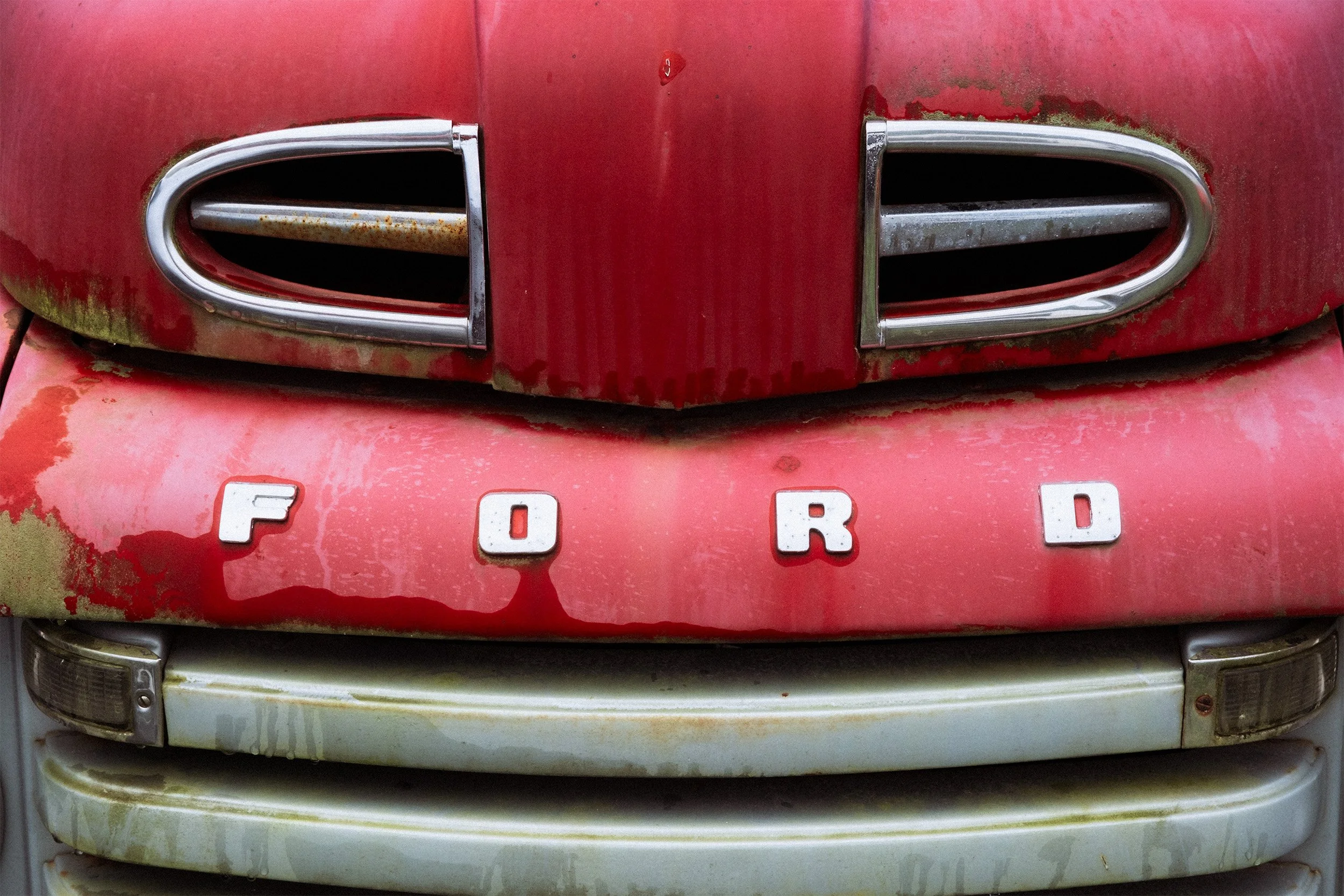 Image of the front grill of a 1951 or 52 Ford F-series pick-up truck.