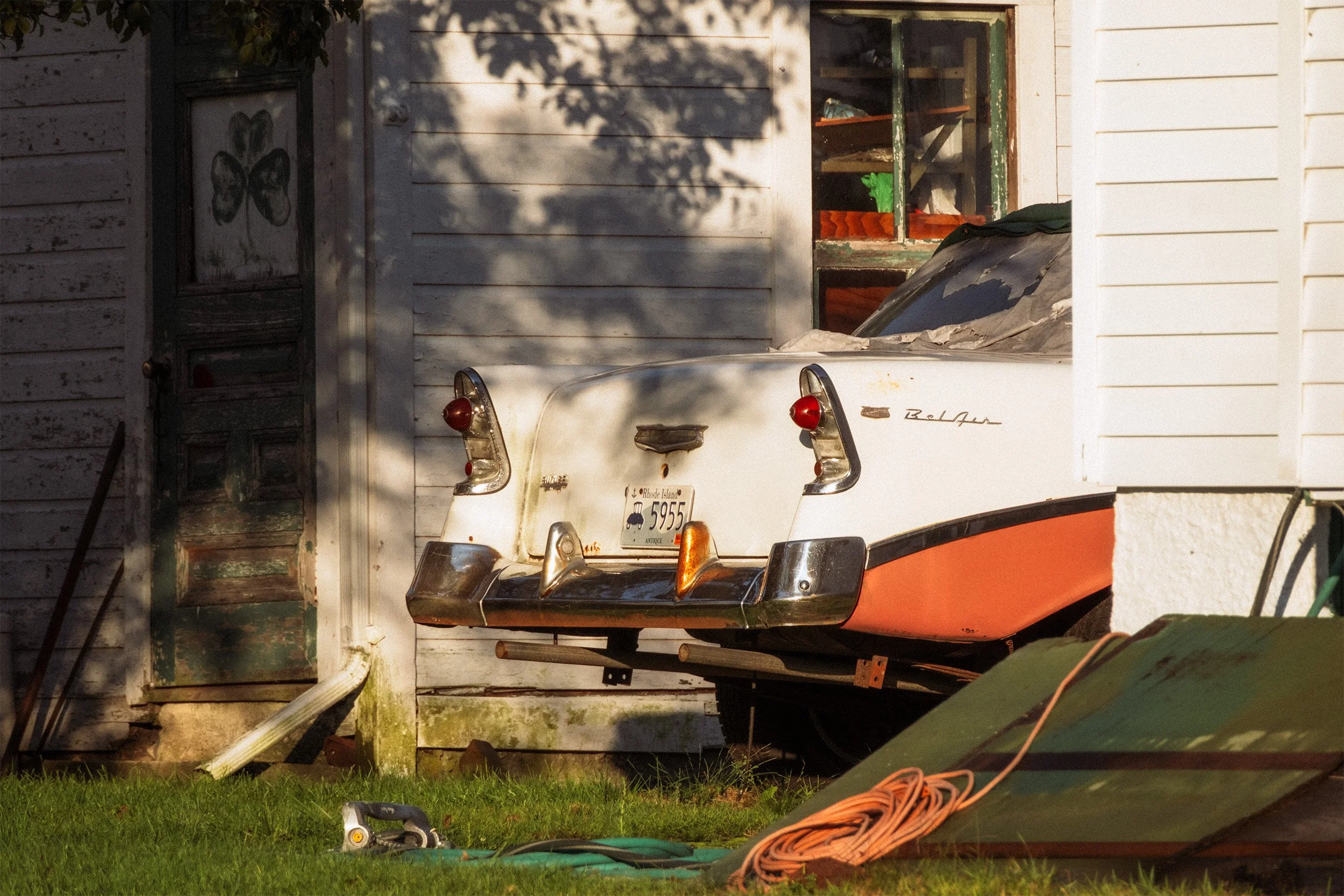 Image of the back end of a white and orage Chevrolet Bel Air